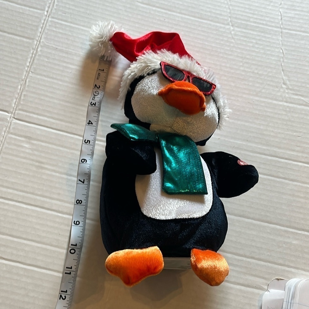 Hugfun-penguin, plush, animated, singing, jingle bells and dancing.